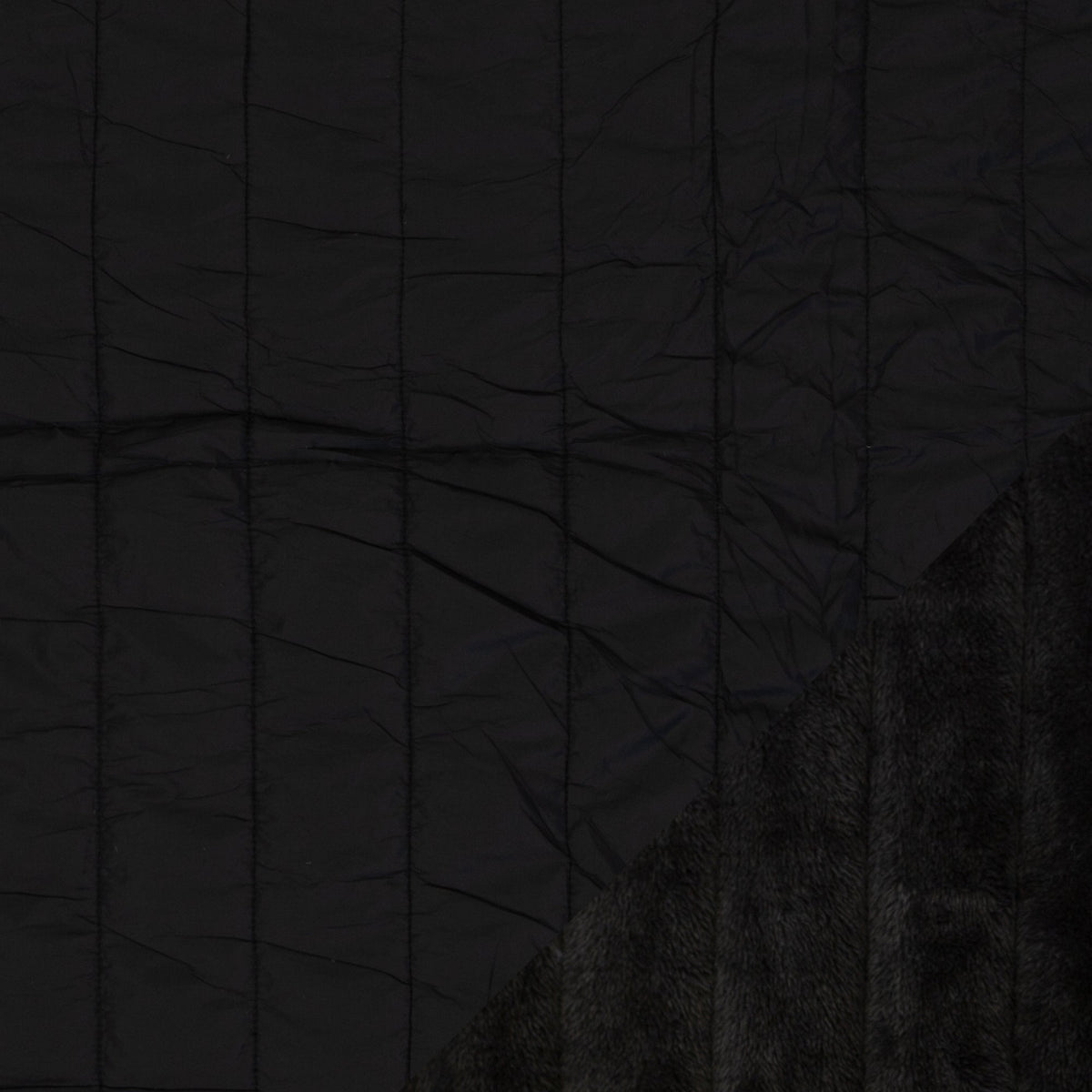 Image of quilted fabric with fleece lining - black, available online at Charlotte's Fabrics