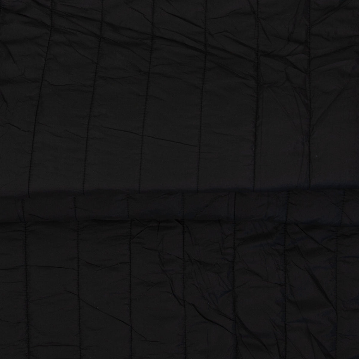 Image of quilted fabric with fleece lining - black, available online at Charlotte's Fabrics