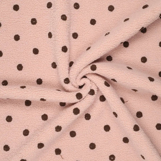 Image of Teddy fleece with brown polka dots on pink – available online at Šarlotes audumi