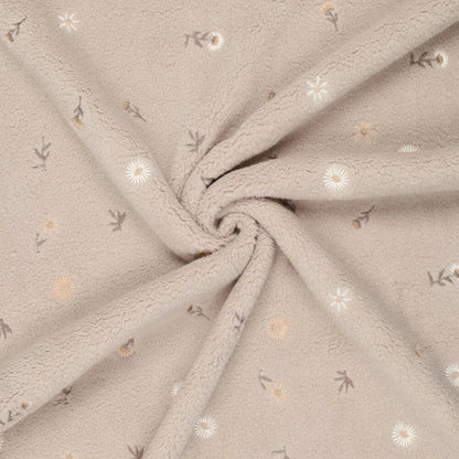 Image of Teddy fleece-embroidered flowers on a beige background – available online at Charlotte's Fabrics