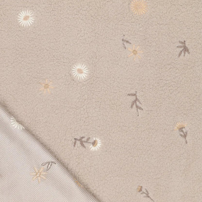 Image of Teddy fleece-embroidered flowers on a beige background – available online at Charlotte's Fabrics