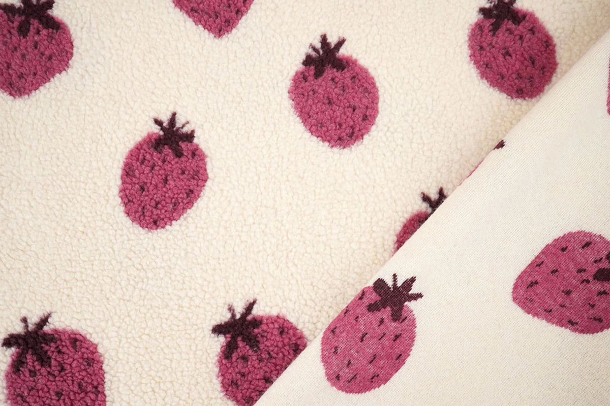 Teddy fleece strawberries – available online at Šarlotes audumi