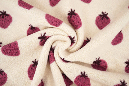 Teddy fleece strawberries – available online at Šarlotes audumi
