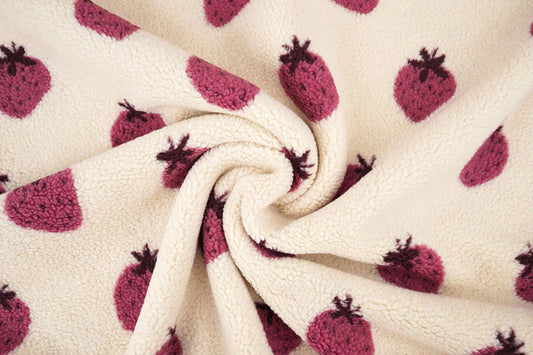 Teddy fleece strawberries – available online at Šarlotes audumi