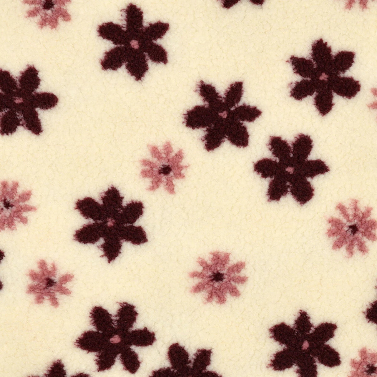 Image with Teddy fleece flowers on a light background – available online at Šarlotes audumi