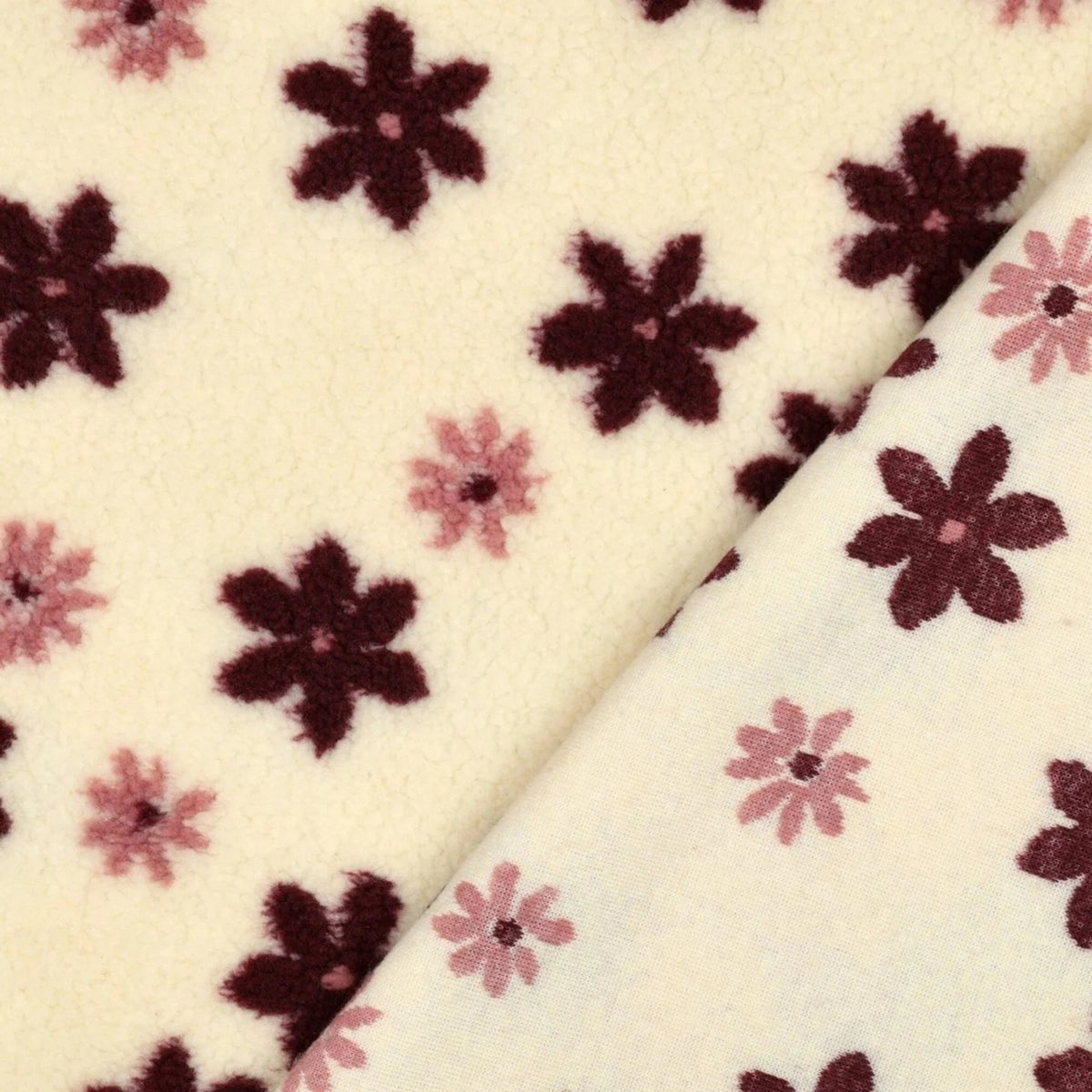 Image with Teddy fleece flowers on a light background – available online at Šarlotes audumi