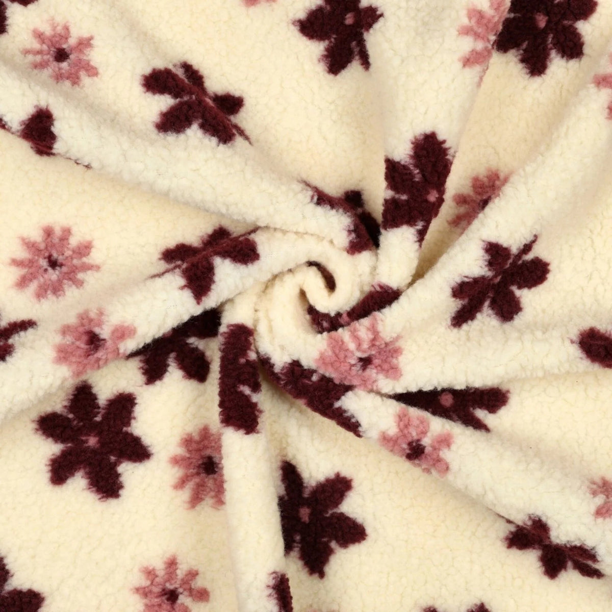 Image with Teddy fleece flowers on a light background – available online at Šarlotes audumi