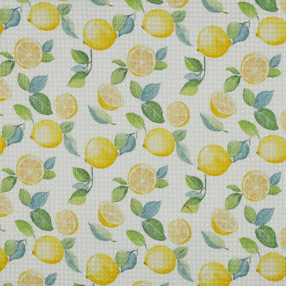 Image de tissu gaufré - citrons 185 g/m² – disponible chez Šarlotes audumi