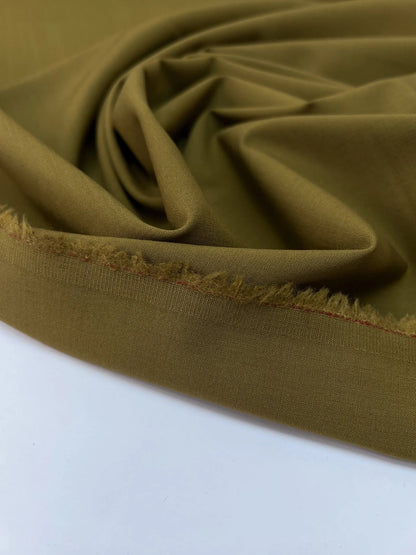 Image of wool fabric with elastane in green-brown – France – available online at Charlotte's Fabrics