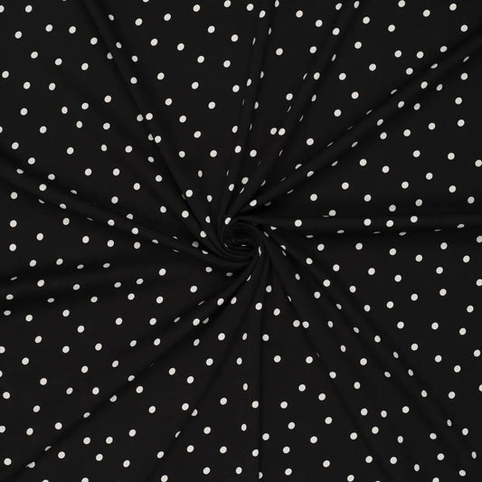 Image of viscose fabric with elastane—white polka dots on black, available online at Šarlotes audumi