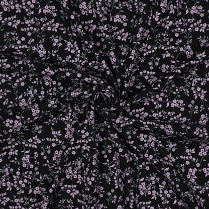 Image of viscose fabric with elastane, delicate floral pattern on black – available online at Šarlotes audumi