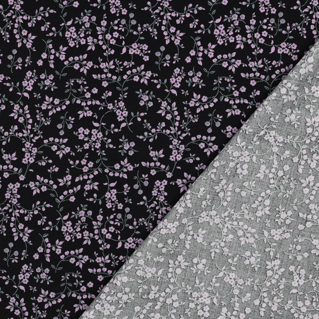 Image of viscose fabric with elastane, delicate floral pattern on black – available online at Šarlotes audumi