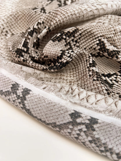Image of viscose crepe fabric with a snakeskin pattern in beige tones – Italy – available online at Charlotte's Fabrics