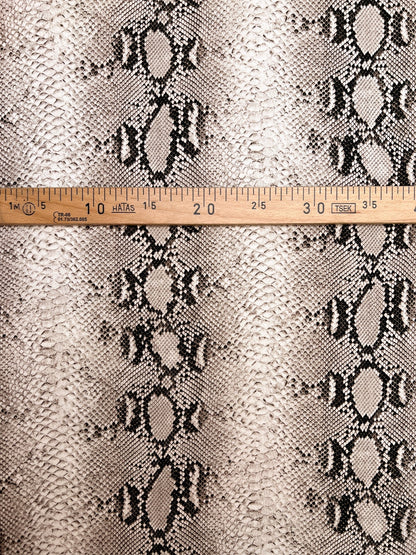 Image of viscose crepe fabric with snakeskin pattern in beige tones – Italy – available online at Šarlotes audumi