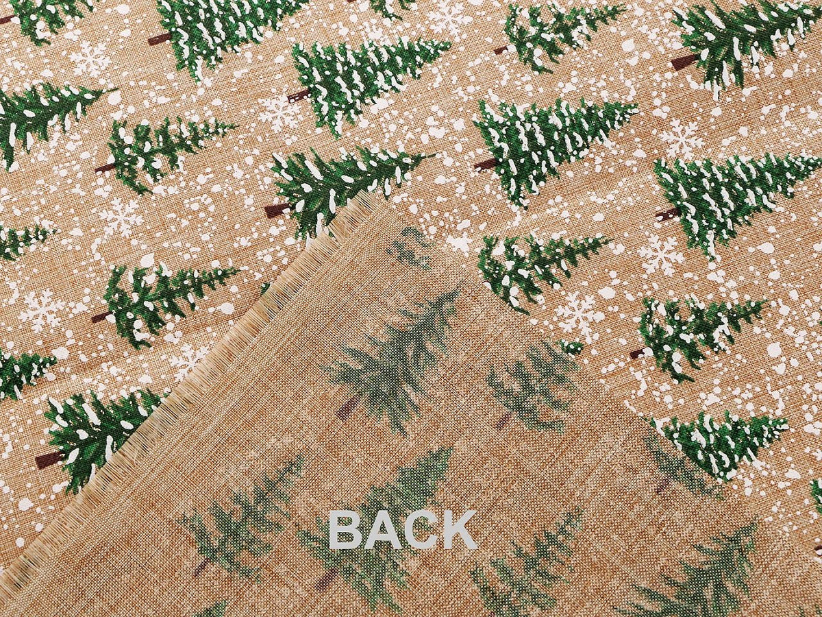 Image of Christmas decorative fabric with fir trees and snow – available online at Charlotte Fabrics