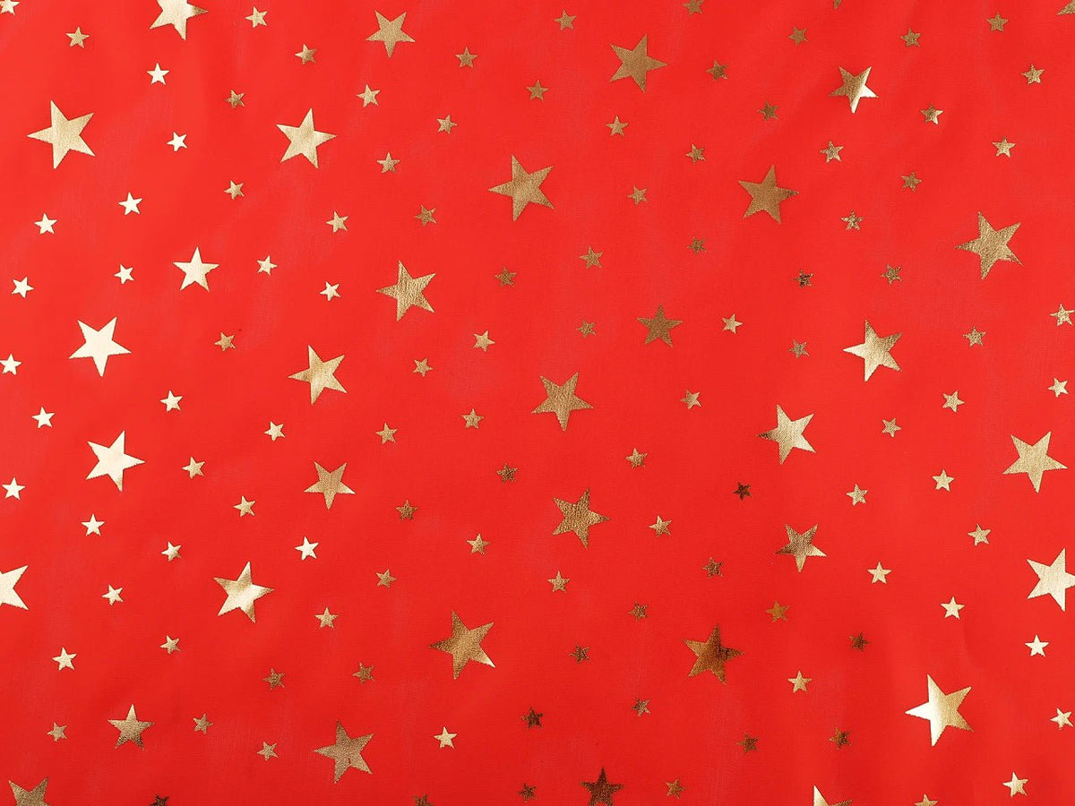 Image of Christmas decorative fabric with gold stars – available online at Šarlotes audumi