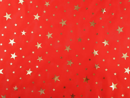 Image of Christmas decorative fabric with gold stars – available online at Šarlotes audumi