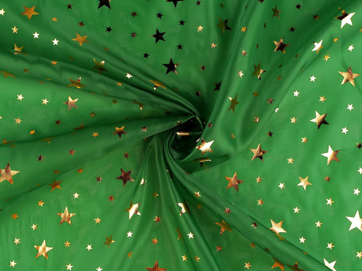 Image of Christmas fabric with gold stars on green – available online at Charlotte's Fabrics