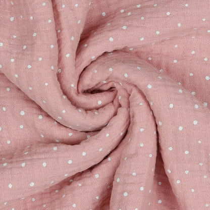 Muslin polka dots on a pink background 125 g/m²